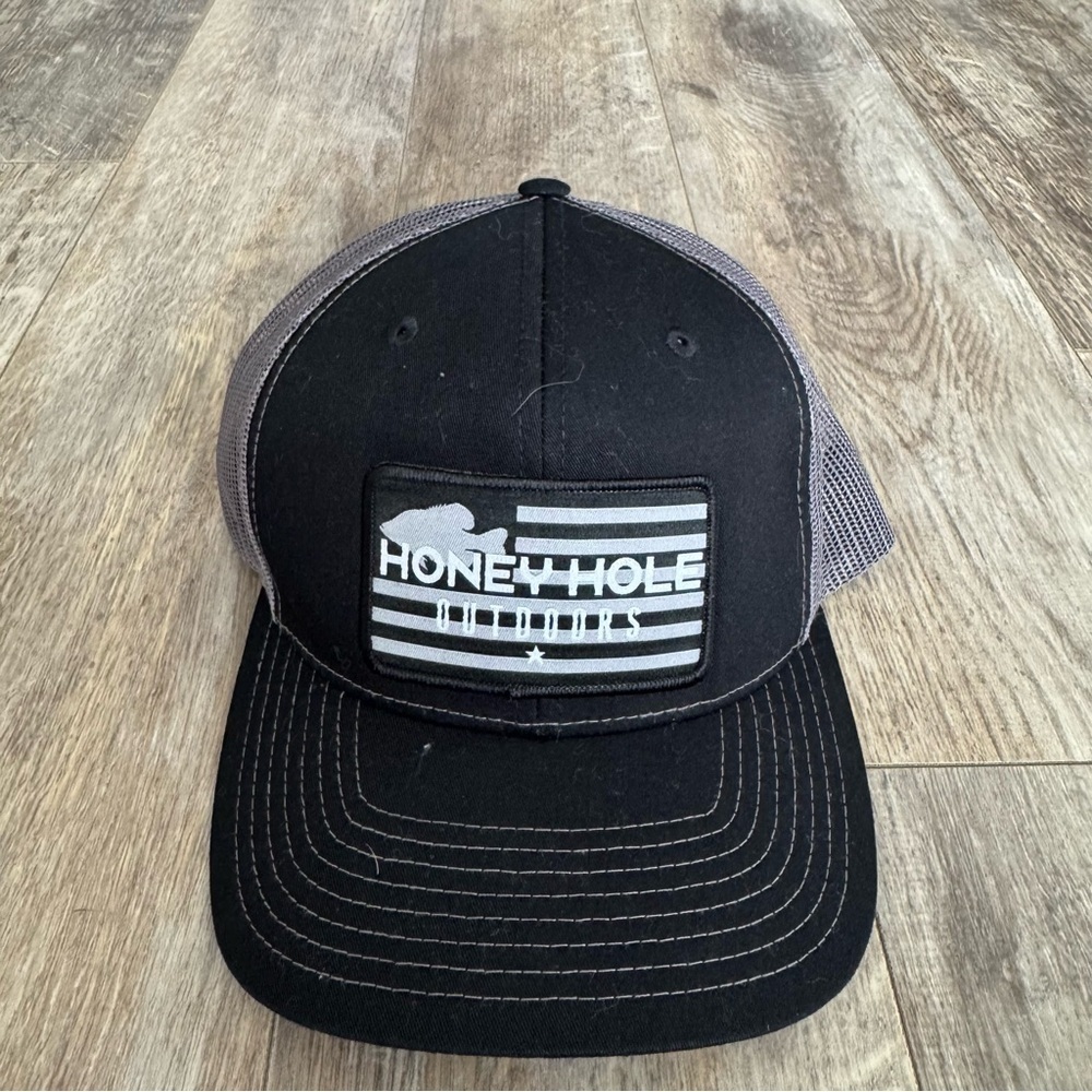 Honey Hole Outdoors snapback trucker hat with a flat bill